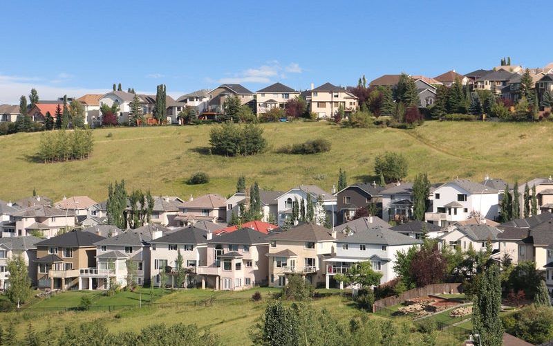 Homes on the green hillsides of northwest Calgary