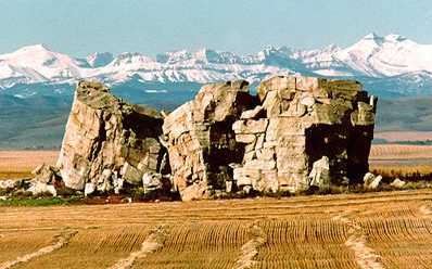 The Big Rock glacial erratic near Okotoks with the Rockies behind