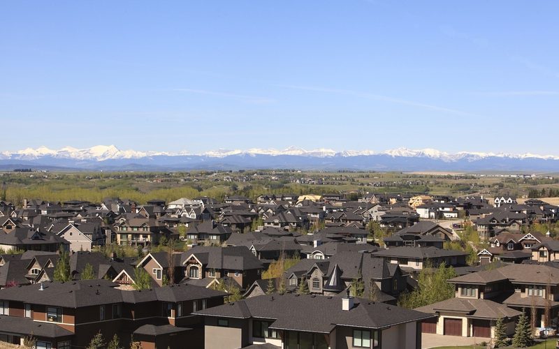 Southwest Calgary homes with the Rocky Mountains beyond